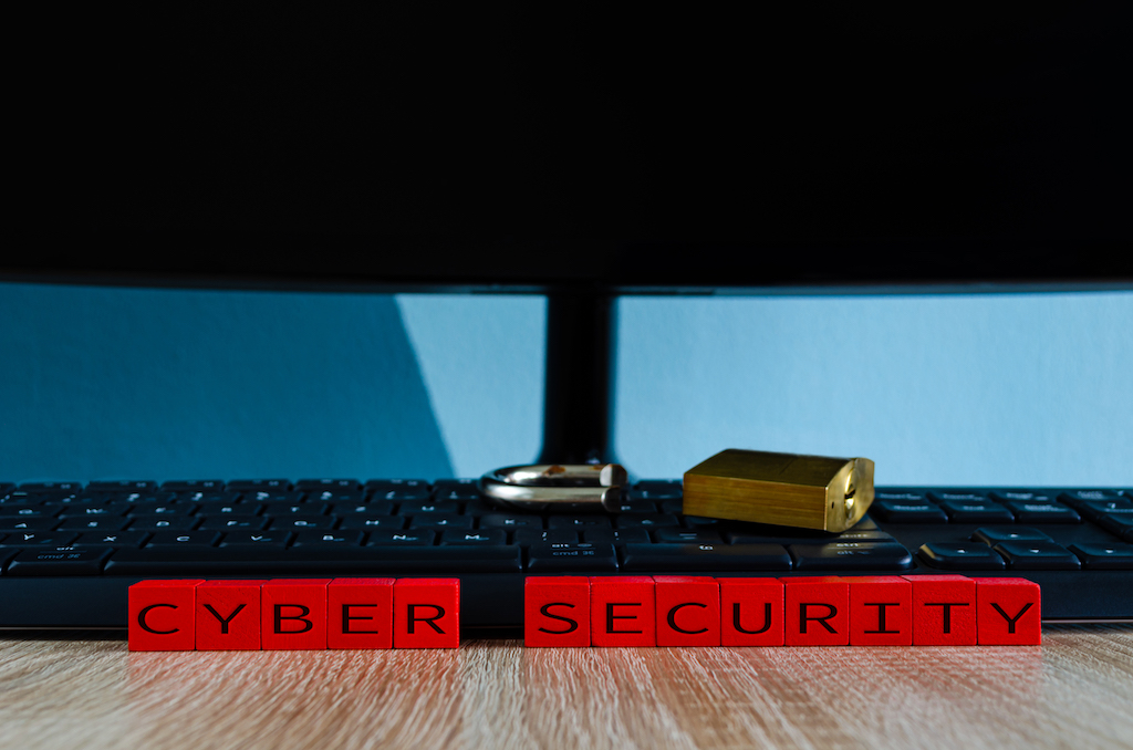 Broken padlock on computer keyboard as a concept for spyware, trojan security breach or data theft